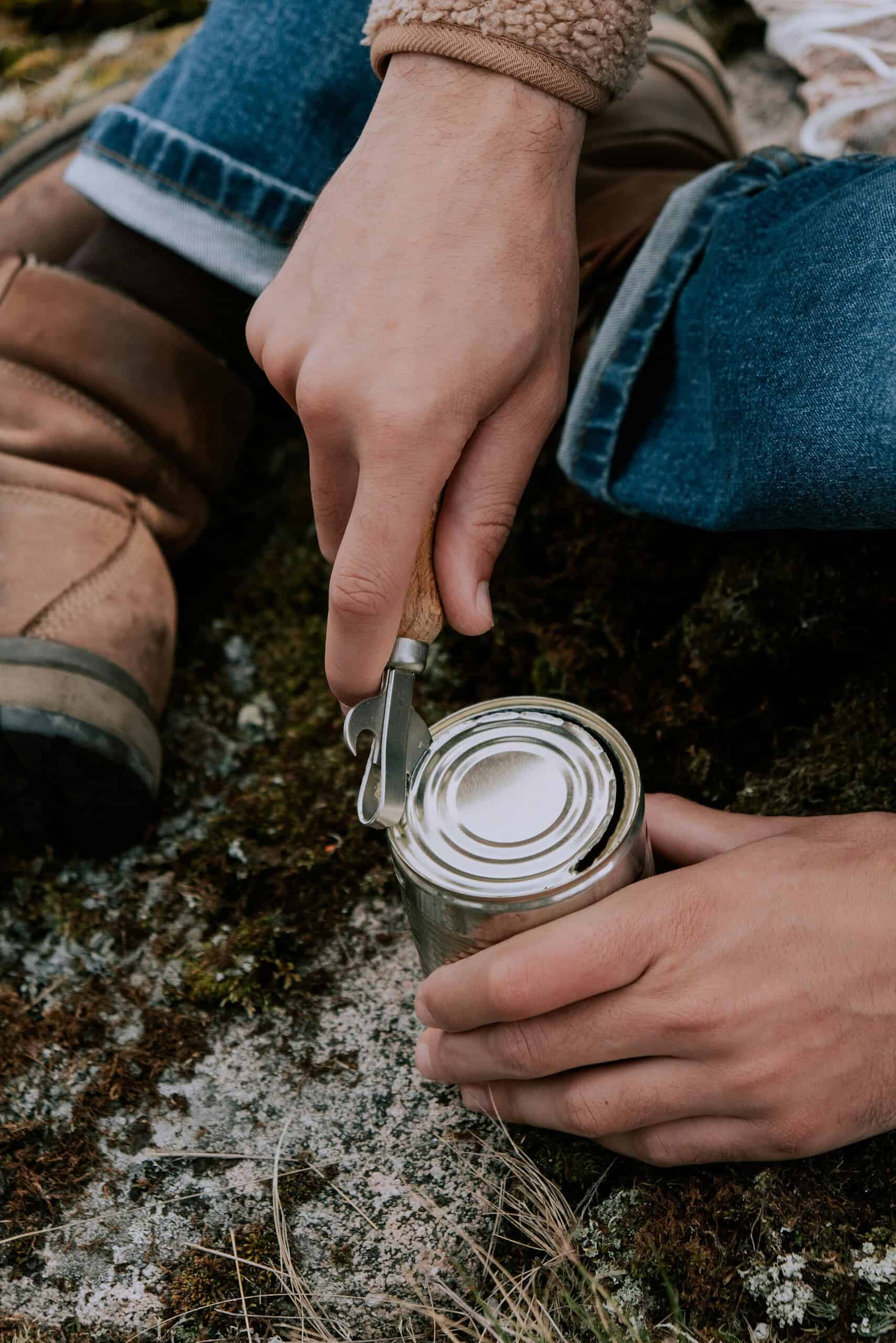 a person opening a can