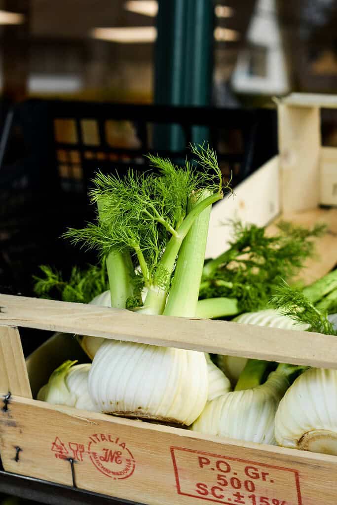 Fennel for sale in a wooden crate