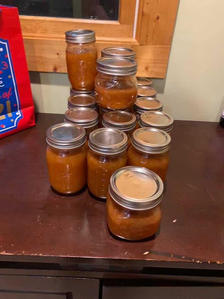 jars of peach jams ready to be canned