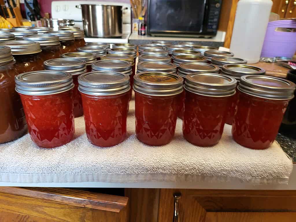 jars of strawberry jam in a countertop