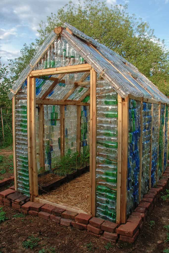 a DIY greenhouse constructed entirely from repurposed plastic bottles.
