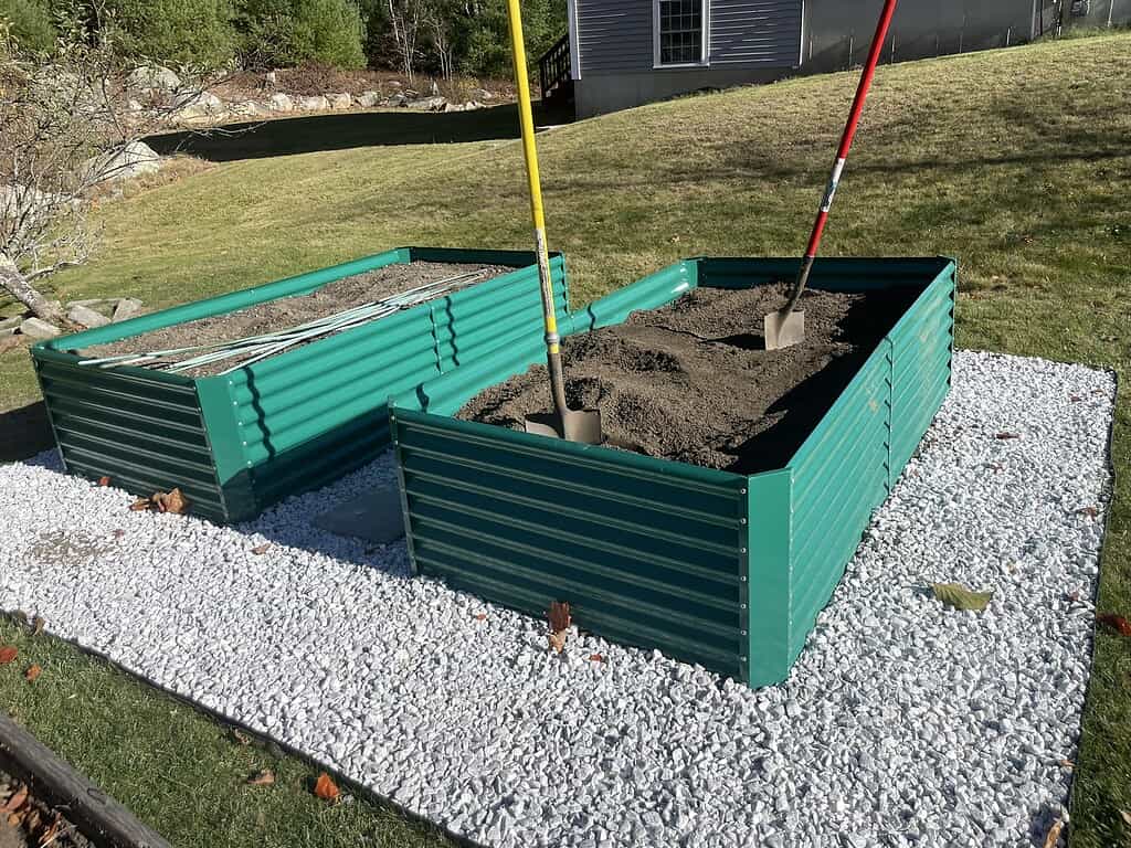a modern raised garden bed setup in a suburban backyard during bright daylight