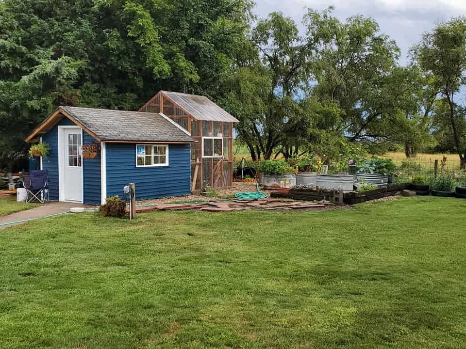 a conventional shed + greenhouse addition built with new lumber and proper framing